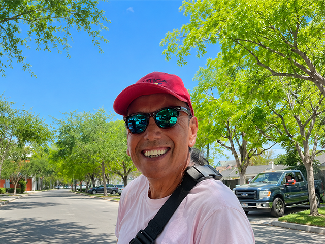 man wearing red hat and sunglasses