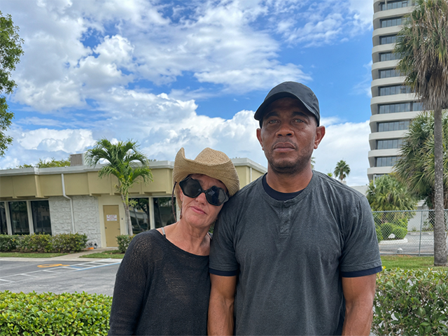 a couple wearing black shirts